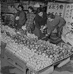 Ruth Buckley at a fruit vendor 1957