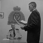 R. L. Stewardson being sworn in by John A. Stevenson (seated) 1957