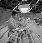 Men working on core samples 1961