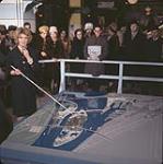 Miss Thébaud with model of Expo 67 site and pointer [ca. 1963-1967]