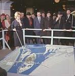 Miss Thébaud with model of Expo 67 site and pointer [ca. 1963-1967]