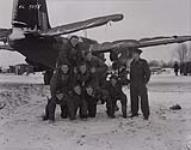 418 Squadron crew members forming a human pyramid in front of a Boston Bomber at RAF Debden 1942