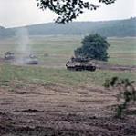 Fallex 84 - training. Hohenfels West Germany. Leopard tanks and APC's advance during training exercises held in Hohenfels as part of the NATO fall manoeuvres. 27 August 1984.