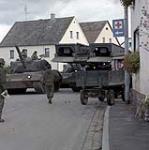 Fallex 84 Bavaria West Germany. Bridgelayer squeeze past a leopard tank and a farmer wagon, during a break in the training exercise held in Bavarian countryside as part of the annual NATO fall manoeuvres September 1984.