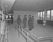 Lt. Gen. Howard D. Graham, Army Chief of the General Staff, is shown inspecting the new Men's Club at Camp Gagetown, N.B n.d.