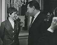 Nancy Greene, Olympic ski champion, chatting with Hon. Allan J. MacEachen at a reception at the Chateau Laurier in Ottawa 27 February 1968