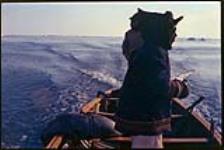 [Inuk men in a boat with a dead seal] [between 18 April-3 May 1962]