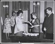 [Award or certificate being presented by teacher Mrs. L. Gillis to Viola Burns] [ca. 1962]