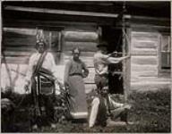 [Family on front of cabin] 1913