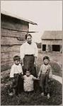 [Unidentified First Nations woman, her two boys, and young toddler] [between 1910-1921]