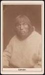 [Portrait of Inuk man from Nunatsiavut (Labrador) wearing parka with fur trim hood] [ca. 1885]