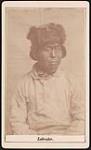 [Portrait of Inuk man from Nunatsiavut (Labrador) wearing fur trim hat] [ca. 1885]