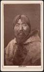 [Portrait of Inuk man from Nunatsiavut (Labrador) wearing parka, possibly of caribou fur] [ca. 1885]