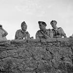 Studying map and Jerry-locations from castle ramparts. PPCLI O/C Lt-Col. G.B. Ware and Major D. Brain 1943