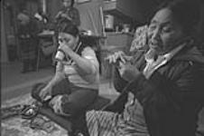 [Kenojuak Ashevak and her mother Silaqqi playing Patik] December 1980