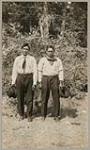 [Two Anishinaabe men standing outside] 1920