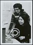 [Two unidentified women with typewriting equipment] [ca. 1960-1970]