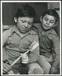 [Two unidentified boys in a classroom] [ca. 1950-1960]