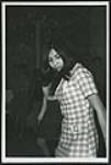 [Unidentified young woman dancing at a party] [ca. 1960-1970]