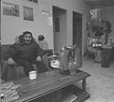 [Abraham Etungat and family in the kitchen] December 1980
