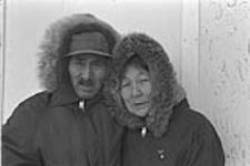 [Portrait of Abraham Etungat and Itigayaqyuaq Etungat outdoors] December 1980
