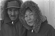 [Portrait of Abraham Etungat and Itigayaqyuaq Etungat outdoors] December 1980