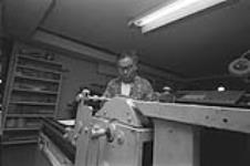 [Inuk printer working at West Baffin Cooperative] November 1980