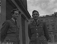 RCAF photo shows F/O P.M. Anderson (left) and F/L Charles R. Blumenauer after being invested with DFC 15 July 1943.