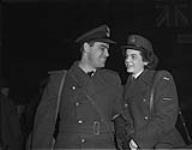 LAW D. Reno, stationed at the RCAF Repatriation Depot, Lachine, waited several hours last evening to greet F/L Douglas R. Pamplin when he returned from overseas with a large number of RCAF repats. Friends of long standing, they met at RCAF Station St. Huberts where F/L Pamplin was training for his wings n.d.