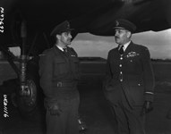 Second Lieutenant Jack Watts meets Air Vice Marshal C.M. McEwan April 26, 1945.