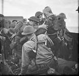 [Wounded Canadian troops boarding a vessel after raid on Dieppe, France, 19 August 1942.] August 19, 1942.