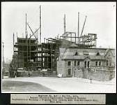 Federal District Improvement Commission Records. Confederation Building - Progress view looking west from Parliament Hill, West Gate 1929
