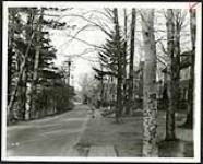 [Residential street with wood planks preparing for sidewalks (Aylmer St. /Echo Drive area?) ] [1927-1932].