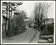 [Residential street with wood planks preparing for sidewalks (Aylmer St. /Echo Drive area?) ] [1927-1932].