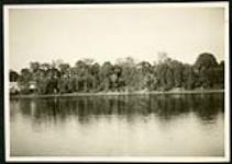 [View of riverside with end of Cummings Bridge on left side] [1927-1932].