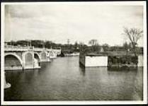 [View of Cummings Island and Cummings Bridge from riverbank] [1927-1932].