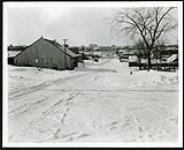 [Residential street in Sandy Hill with Canadian Museum of Nature in distance] [1927-1932].