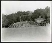 [Workers resting against gazebo from road construction at Rockcliffe Park] [1927-1932].