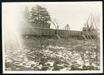 [View of Champlain bridge under construction with crane on right] [1927-1932].