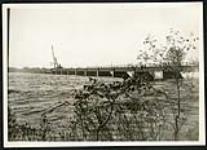 [View of Champlain bridge under construction with crane on far left] [1927-1932].