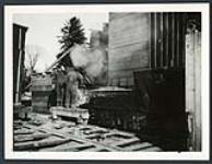 [Two men working on machinery at the construction site for the Champlain Bridge] cira 1924-1928.