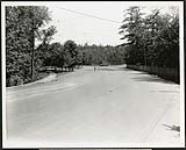 Federal District Improvement Commission Records. Looking east along Rockcliffe Drive towards car sheds July 8, 1930