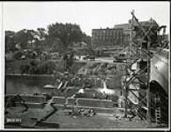[View of widening of Plaza Bridge and driveway construction east of the Rideau Canal] August 25, 1938