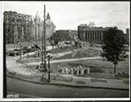[View of construction of the National Memorial and the widening of Plaza Bridge looking east towards Rideau Street] September 29, 1938