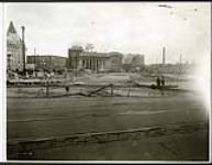 [View of empty lot near Connaught Place looking east towards Union Station] October 20, 1938 