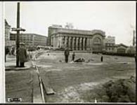[Workers finishing up Plaza Bridge expansion with Union Station in background] October 20, 1938 