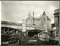 [View of forms for the Plaza Bridge archway expansion with Chateau Laurier in background] December 7, 1938