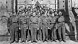[Portrait of members of the Royal Canadian Postal Corps posing before the Base Post Office, Ottawa, 1939-1946] [graphic material] [between 1939 and 1945]