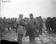 (Prime Minister Sir Robert Borden visits the Western Front) Hon.Bob Rogers meets an old friend. March, 1917 March, 1917.