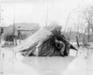 A Canadian finds his tent and home under water. Apri1, 1917.